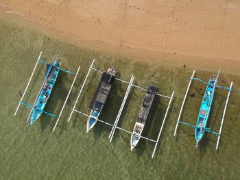 High angle view of boats moored on a sandy beach