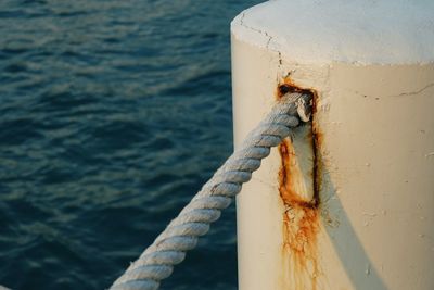 Close-up of rope tied on metal