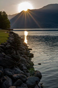 Scenic view of lake against sky during sunset