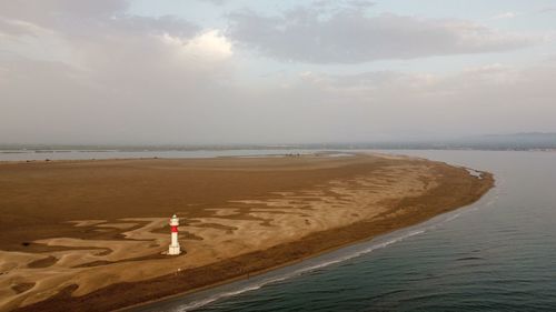 Scenic view of a lighthouse and sea against sky 