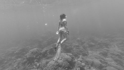 Full length of woman enjoying in sea