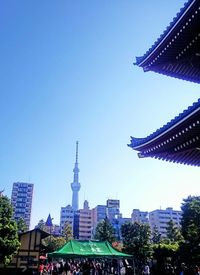 View of skyscrapers against blue sky