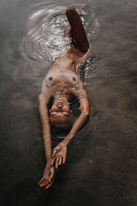 Low section of woman in water