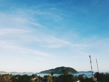 Scenic view of mountains against blue sky