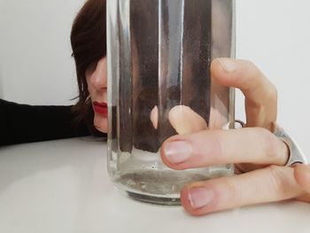 Close-up of woman hand holding glass