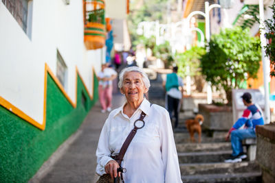 Senior woman tourist at the beautiful heritage town of jerico located in colombia.