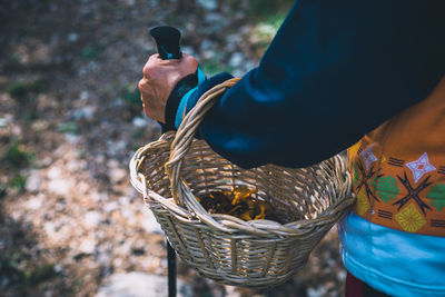 High angle view of man holding ice cream in basket