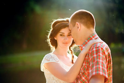 Couple romancing while standing outdoors