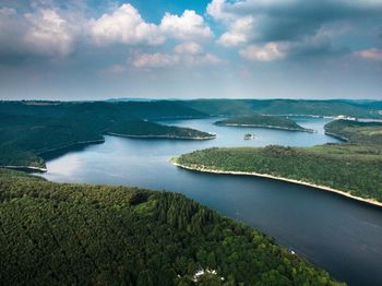 Scenic view of lake and mountains against sky