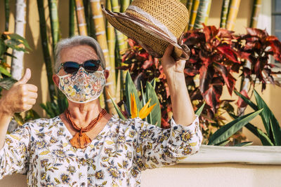 Portrait of woman wearing sunglasses outdoors