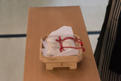 Close-up of paper in box on table