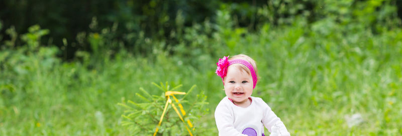 Portrait of girl standing on field