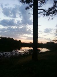 Scenic view of lake at sunset