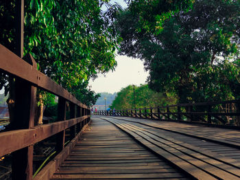 Wooden footbridge over river