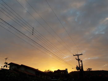 Low angle view of silhouette buildings against sky during sunset