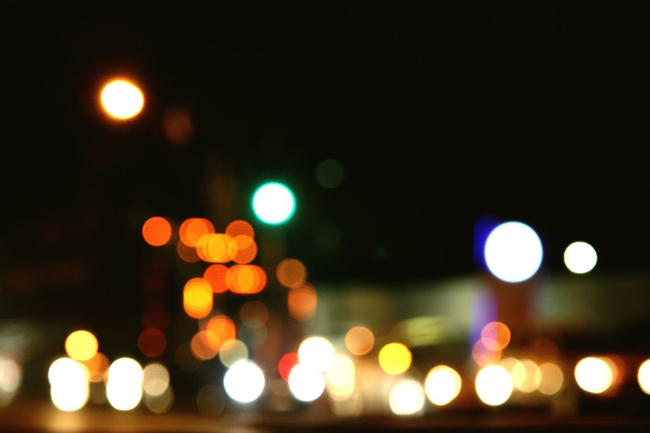 illuminated, night, defocused, multi colored, circle, lighting equipment, glowing, light - natural phenomenon, lens flare, city, no people, outdoors, light, street, sky, street light, abstract, light effect, transportation, yellow