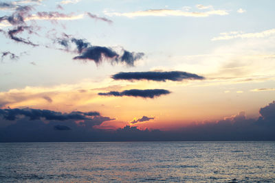 Scenic view of sea against sky at sunset