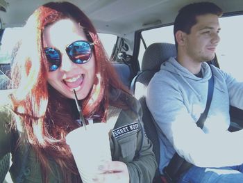 Young man and woman in car