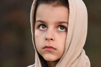 Close-up portrait of young woman with eyes closed