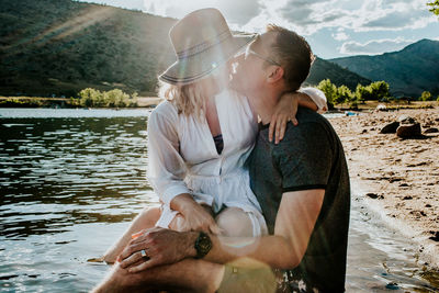 Young couple kissing in lake