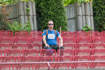 Portrait of man sitting on chair