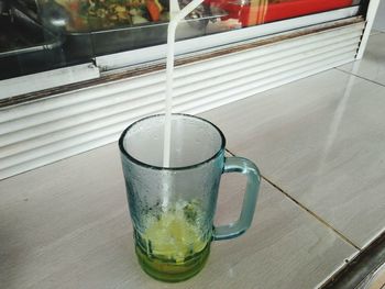 High angle view of drink in glass on table