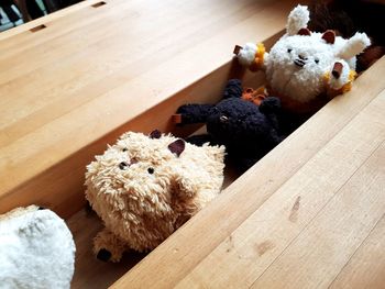 High angle view of stuffed toy on wood