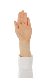 Close-up of woman hand against white background