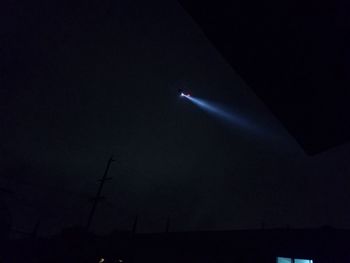 Low angle view of illuminated sky at night