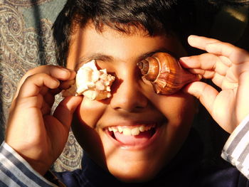 Close-up portrait of cute boy smiling