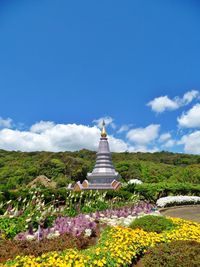 View of cross on mountain against sky