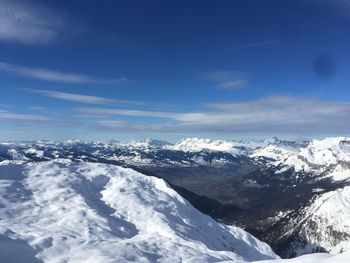 Scenic view of snowcapped mountains against sky