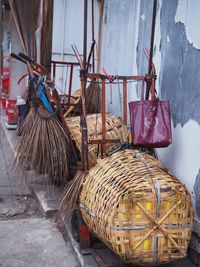 Close-up of wicker basket hanging on wall