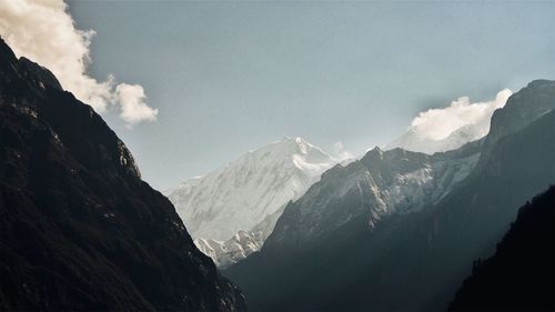 Scenic view of snowcapped mountains against sky