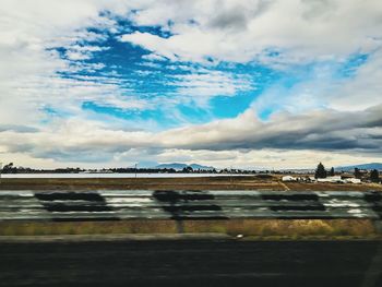 Road against cloudy sky