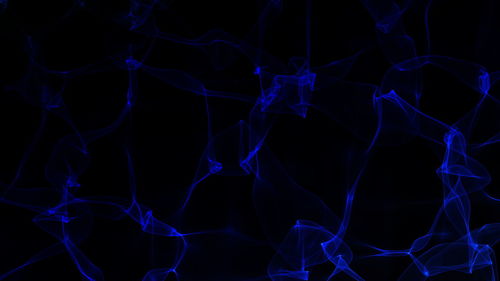 Close-up of light painting against black background