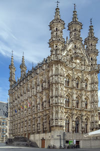 City hall of leuven, belgium, is a landmark building on that city grote markt 