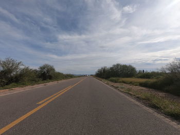 Empty road against sky