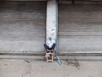 Portrait of man sitting on chair