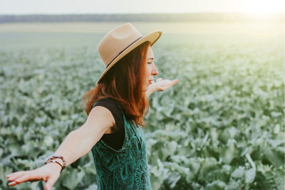 A woman in a field with cabbage. autumn harvest season