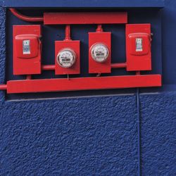 Red meters on wall