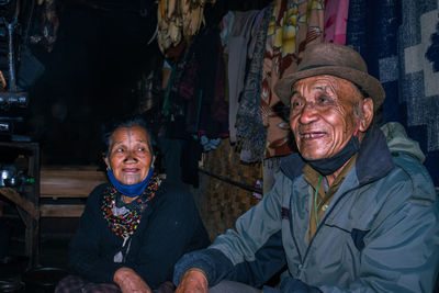 Senior couple sitting at home