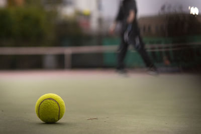 Close-up of tennis ball on field