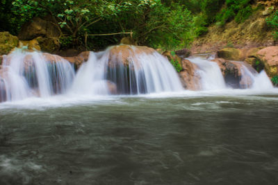 View of waterfall in forest