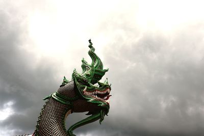 Low angle view of statue against sky