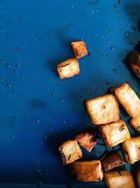 High angle view of bread on wet table