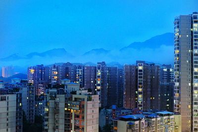 View of city against cloudy sky