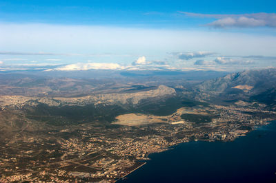 Aerial view of cityscape against sky