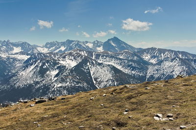 Scenic view of snowcapped mountains against sky