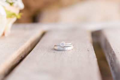 Close-up of wedding rings on table